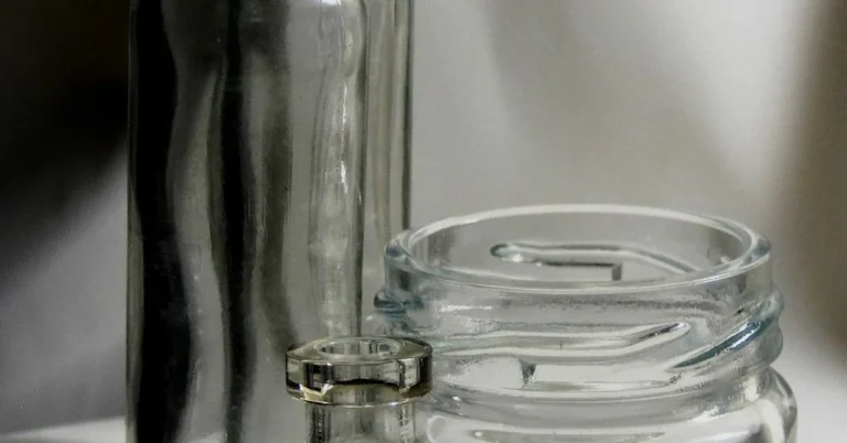 Glass bottles with labels ready for removal