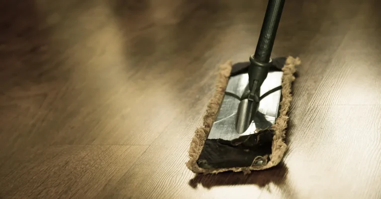 flat mop cleaning a freshly cleaned hardwood floor to a glossy shine