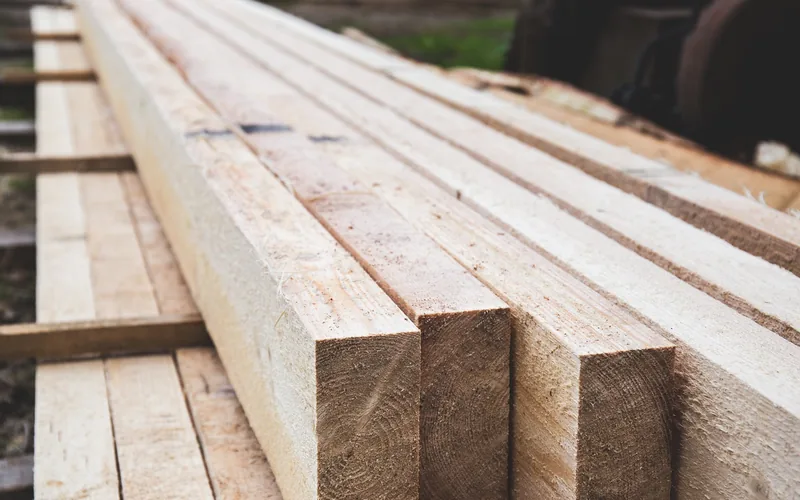 stacked pine lumber boards ready for a coverage calculation
