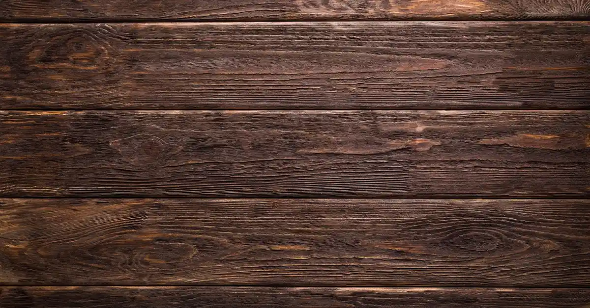close-up of weathered brown wood plank boards showing natural grain