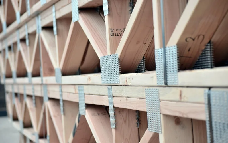 floor joists and framing at a residential construction site before subfloor installation