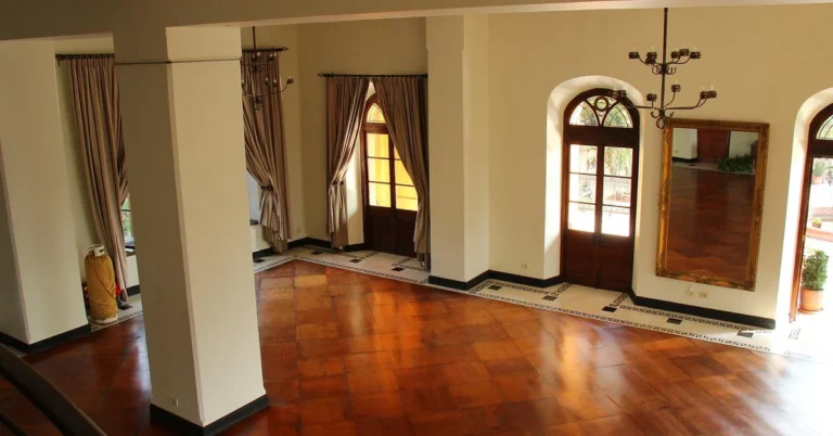 Polished hardwood floor with a rich waxed shine in a bright room