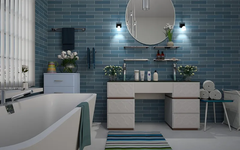 blue-tiled bathroom with white vanity showing an aqua and white pairing