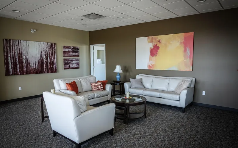 Living room with warm gray painted walls and neutral furniture