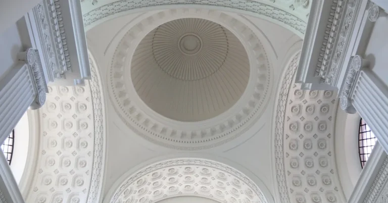 Ornate white domed ceiling reflecting light in a bright room