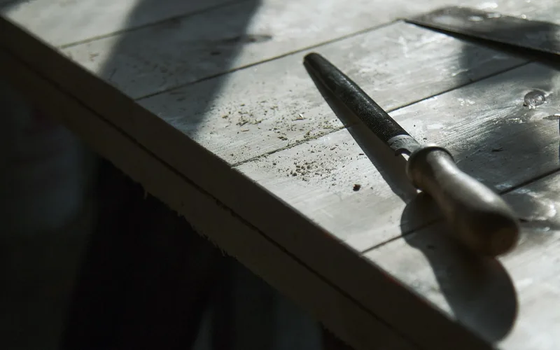 wood rasp file on a carpentry workbench used for furniture repair