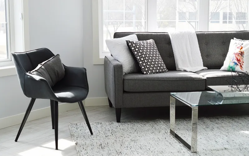 living room with light gray wood-look plank flooring and gray furniture