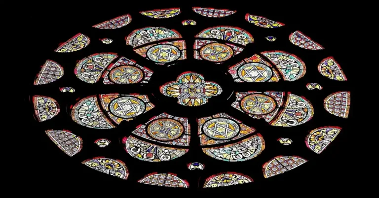 Colorful stained glass rose window with geometric pattern