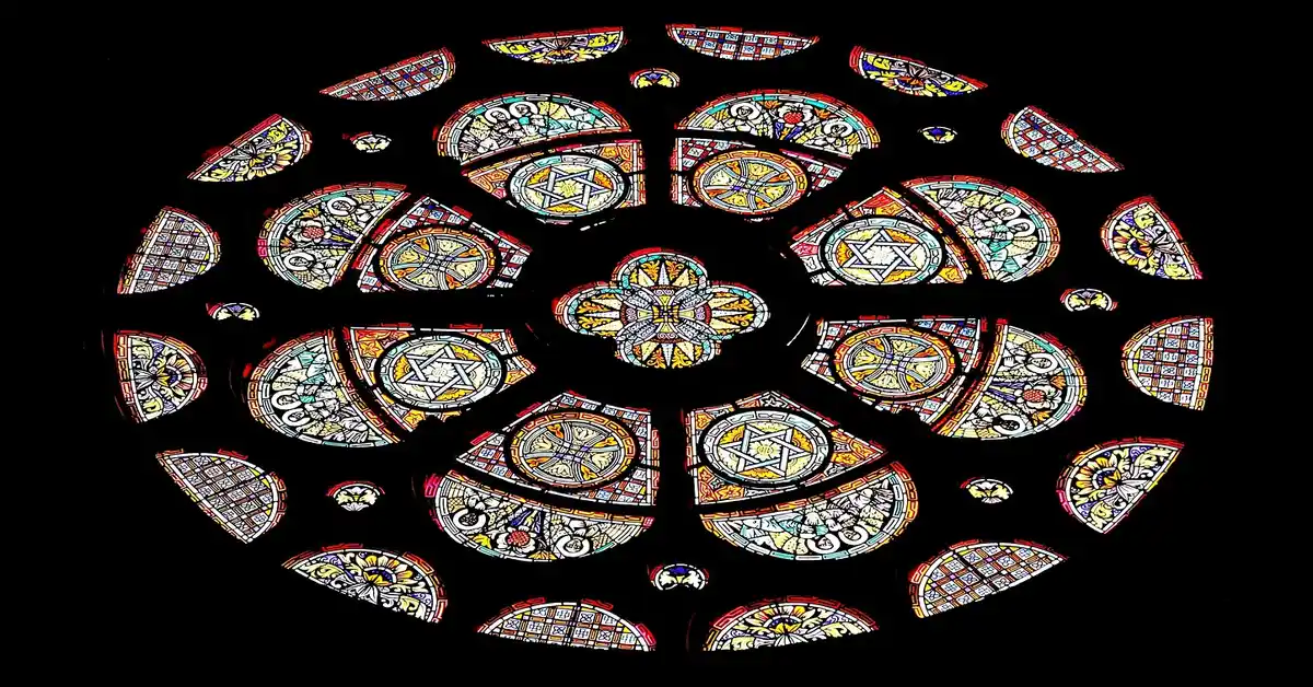 Colorful stained glass rose window with geometric pattern