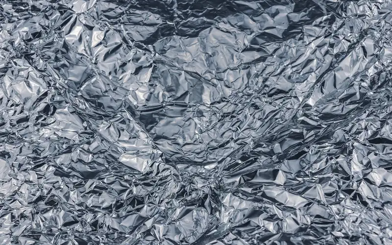 Crumpled aluminum foil texture crumpled sheet of aluminum foil, the material used to mask door hardware while painting