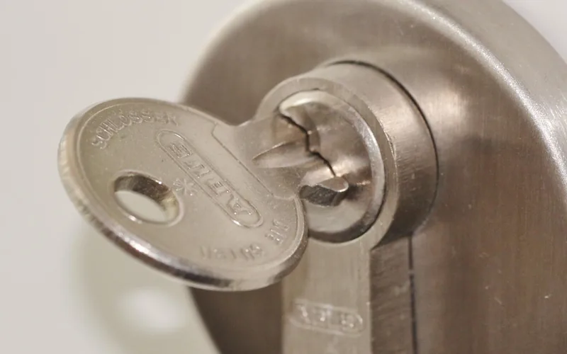 door lock fitting on an entrance door showing latch alignment