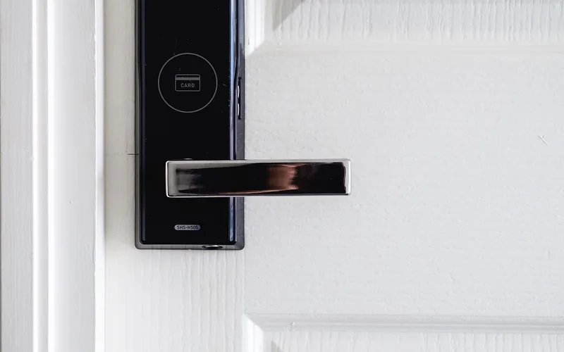 Electronic keypad door lock hardware mounted on an interior door