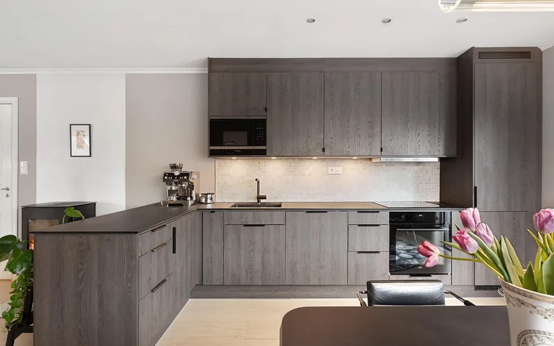 Modern white kitchen cabinet doors and drawers in a well-lit kitchen Modern white kitchen cabinet doors and drawers in a well-lit kitchen