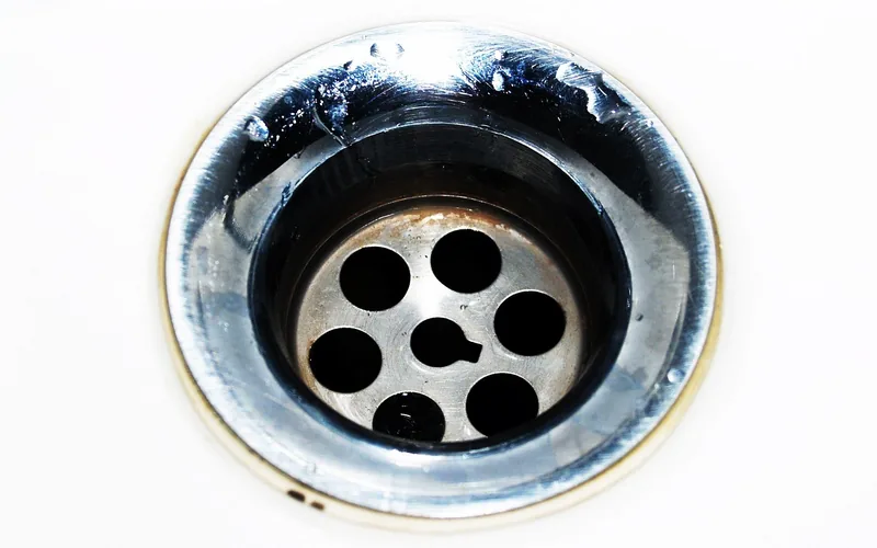 Close-up of a kitchen sink drain strainer