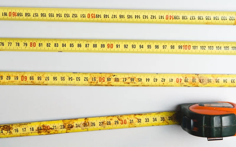 tape measure laid flat used to measure the space before buying a tarp for a canopy