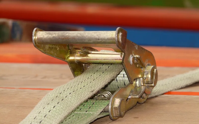 Ratchet strap lashing mechanism used to secure cargo