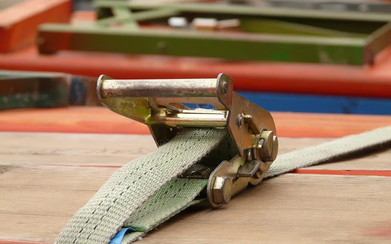 Close-up of a ratchet strap turnbuckle and lashing mechanism