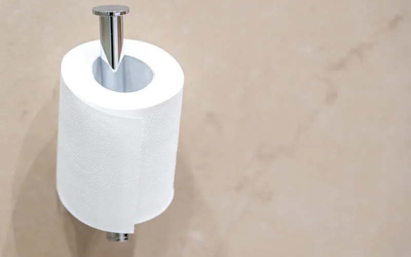 fresh toilet paper roll ready to load into a restroom dispenser fresh toilet paper roll ready to load into a restroom dispenser