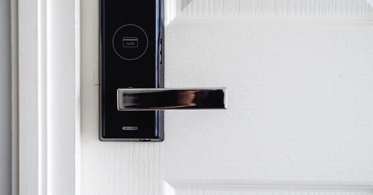 electronic keyless deadbolt lock mounted on a modern front door