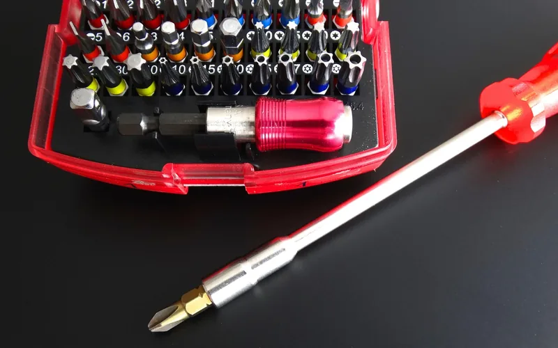 close-up of a flathead screwdriver and bit used for hardware repair