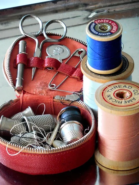 Sewing notions and fabric ready for snap fastener installation