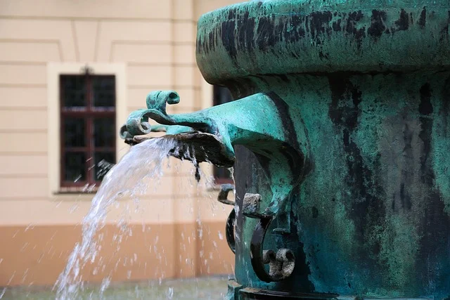Water flowing from a dispenser tap Water flowing from a dispenser tap