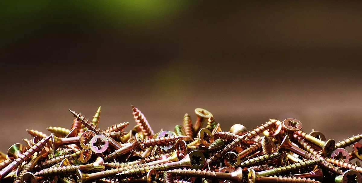 Assorted wood screws showing thread and countersunk heads