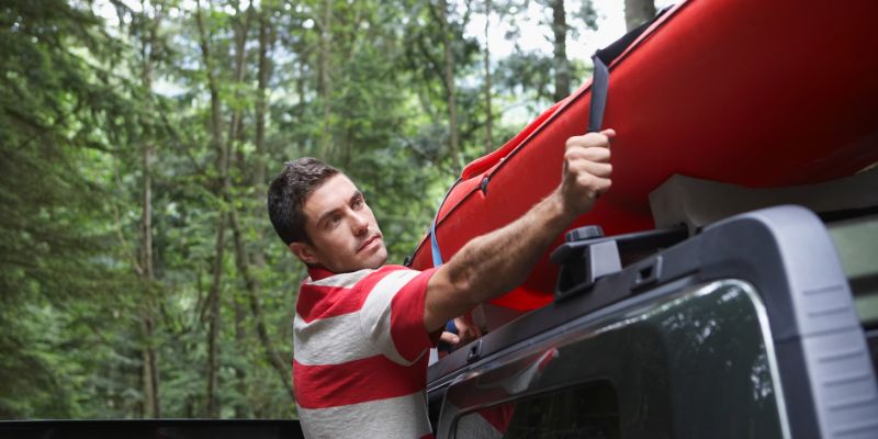 Tying Down the Kayaks with Straps