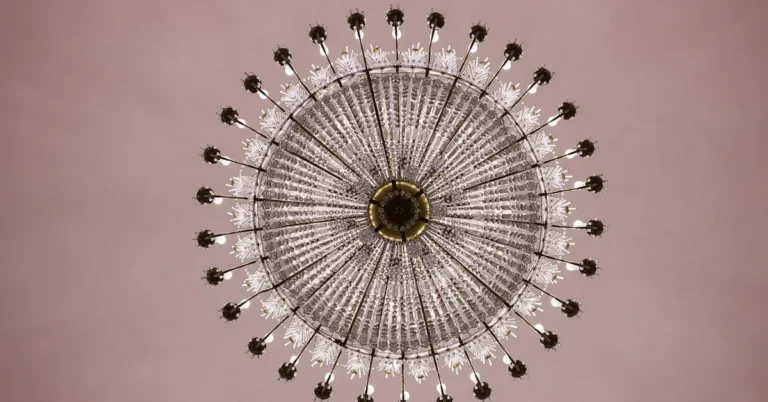 crystal chandelier hanging from a ceiling, viewed from below
