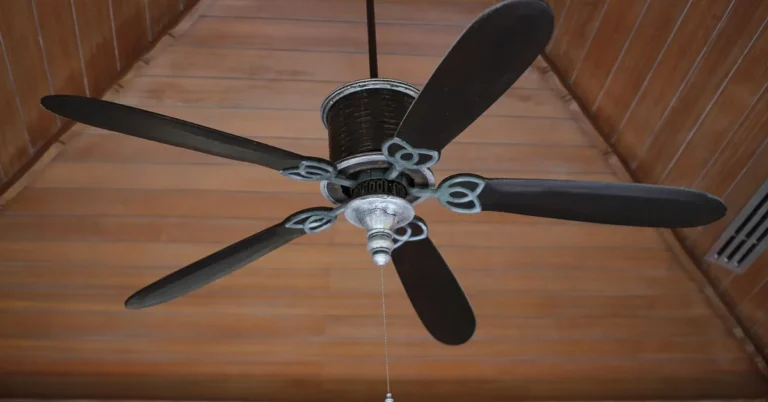 Flush mount ceiling fan installed directly against a bedroom ceiling with no downrod