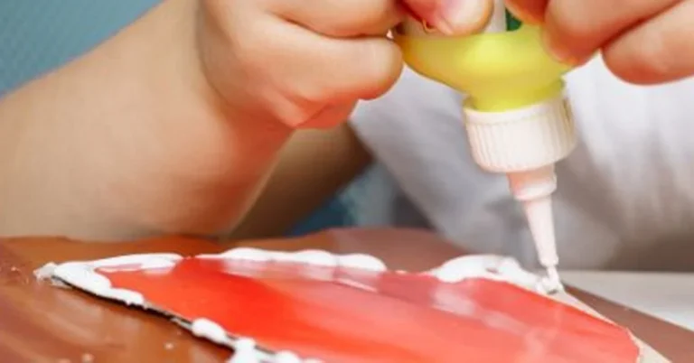 Applying glue to bond styrofoam craft material to a wood surface