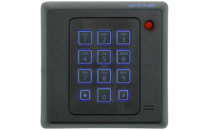 Numeric keypad access control reader mounted beside a door for magnetic lock entry