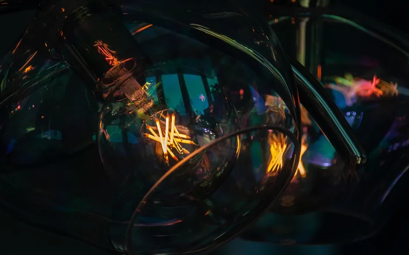Light bulb inside a fixture housing near lamps Light bulb inside a fixture housing near lamps