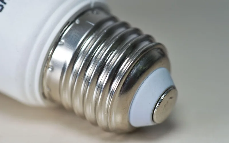 close-up of a medium E26 screw-base light bulb thread used in many ceiling fan light kits