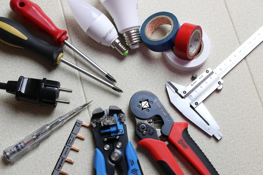 Screwdrivers, electrical tape, and hand tools used to install and wire recessed lighting fixtures Screwdrivers, electrical tape, and hand tools used to install and wire recessed lighting fixtures