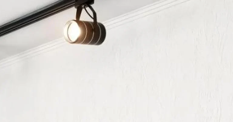 Track lighting head clipped onto an electrified ceiling track showing how track lighting works