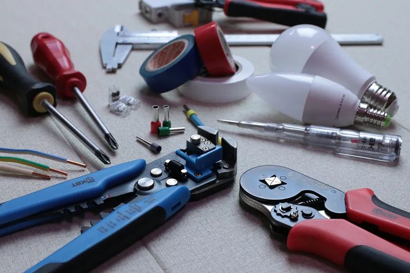 Wire strippers, wire connectors, and LED bulbs used for wiring a recessed light fixture Wire strippers, wire connectors, and LED bulbs used for wiring a recessed light fixture