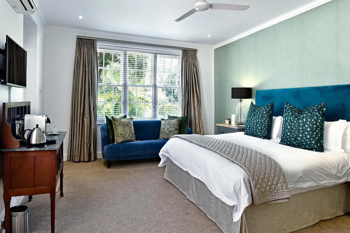 Empty bedroom with a ceiling fan and air conditioning unit