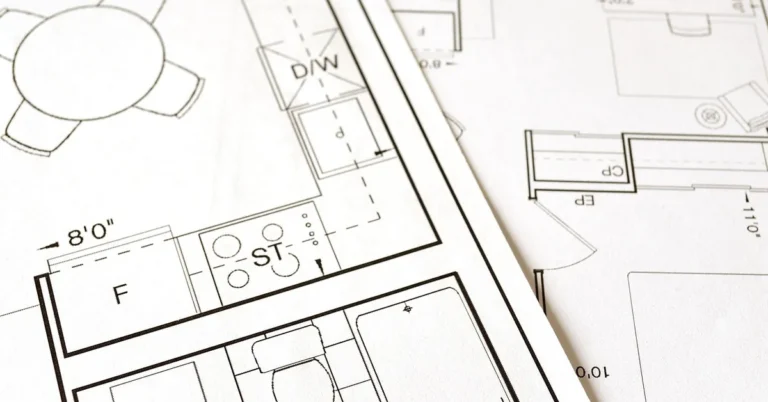 architectural blueprint and floor plan spread out for a home renovation project