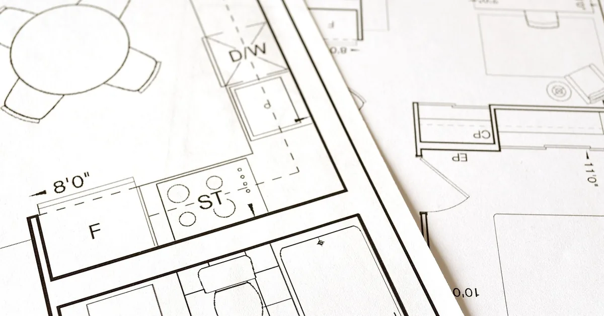 architectural blueprint and floor plan spread out for a home renovation project