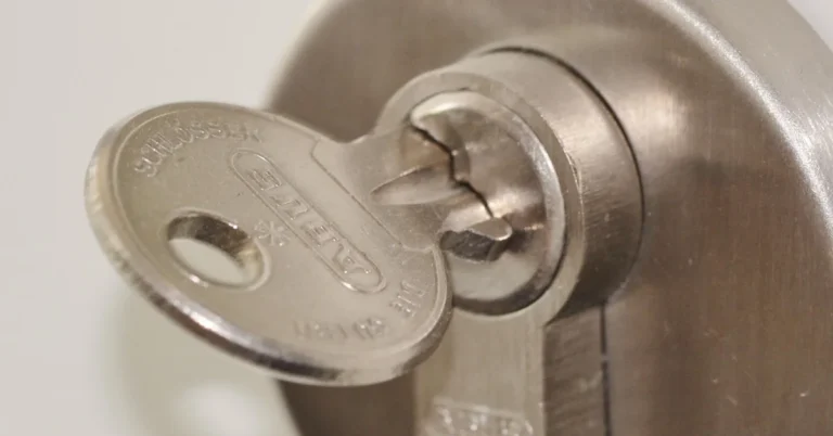 key inserted into a door deadbolt lock cylinder