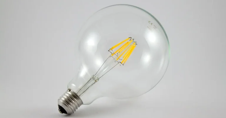 clear LED filament light bulb with visible warm LED filament strands