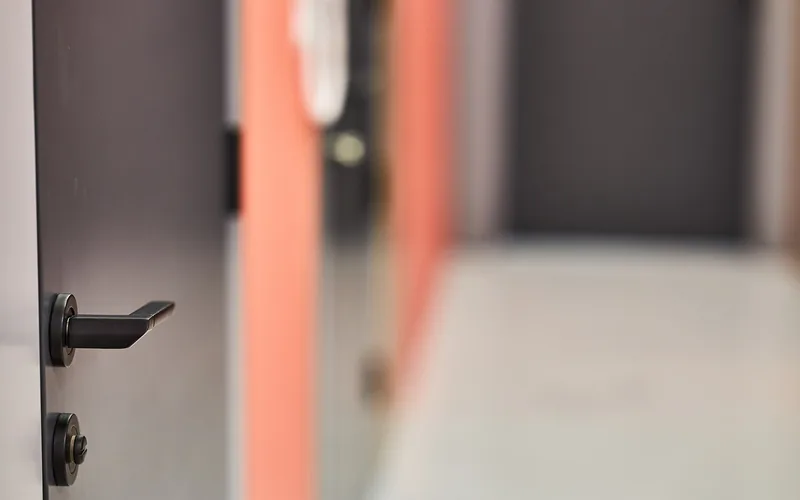 lever handle door lock with deadbolt cylinder installed on a modern interior door