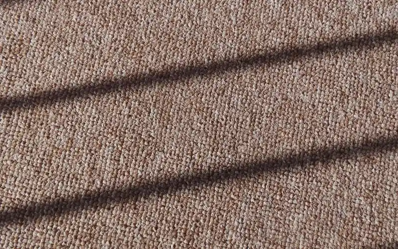 close-up of tightly woven low-pile carpet fibers close-up of tightly woven low-pile carpet fibers