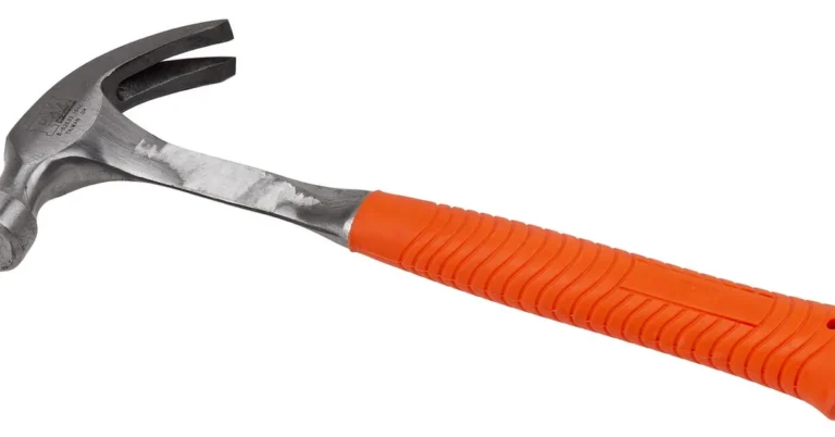 Claw hammer resting on wood for carpentry work
