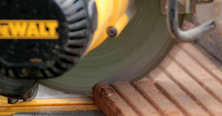 Miter saw blade cutting through a wood board, compared with Ridgid