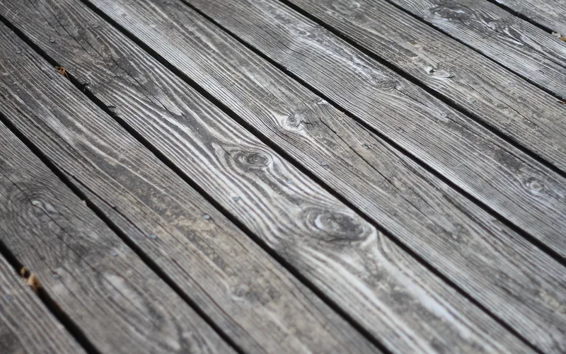 Wood deck planks showing natural grain texture before staining Wood deck planks showing natural grain texture before staining