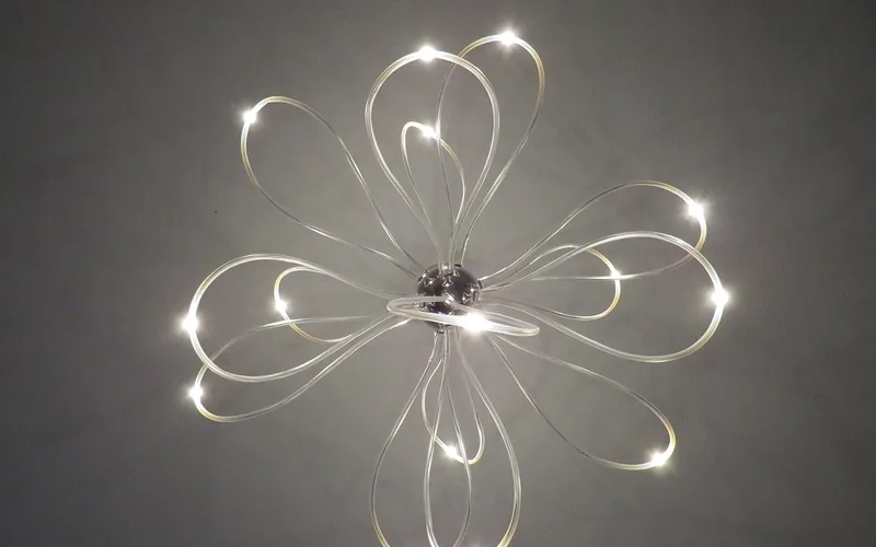 a modern decorative LED ceiling light fixture installed overhead a modern decorative LED ceiling light fixture installed overhead