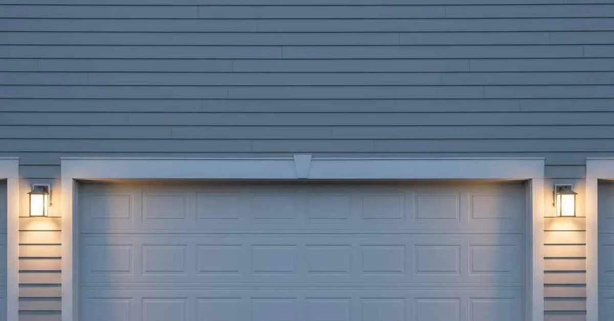 Outdoor garage lights sized to flank a two-car garage door with matching wall sconces