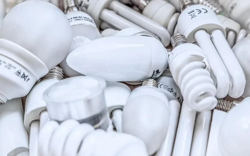 Old fluorescent and compact fluorescent bulbs collected together for proper recycling